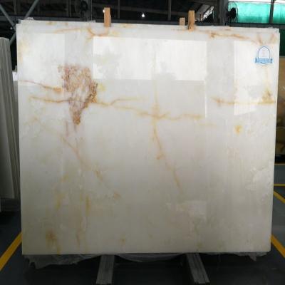 China Modern natural polished white onyx marble ice stone transparent luxury gold silk jade for slab tile background wall panel price for sale