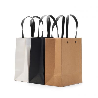 China Recycled Materials Paper Bag Maker White Black Luxury Customize Logo Printed For Jewelry Shopping Tote Handbags for sale