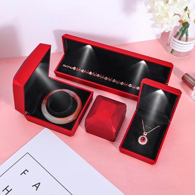 China Fashionable Ring Pendant Jewelry Box Factory Direct Wholesale Jewelry Diamond Shape Design LED Light Packaging Showcase for sale