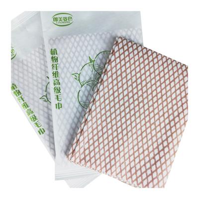 China 30*65 vein hair paper towel beauty hair salon soft durable plain non-woven wrap towel disposable hair towel for sale