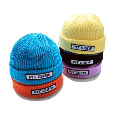 China JOINT Patch Knitted Winter Beanie Hat Bulk Custom Woven Gorro for sale