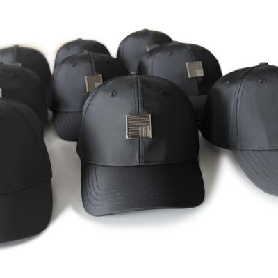 China Waterproof Black Design Customized Letters Metal Badge Baseball Cap for sale