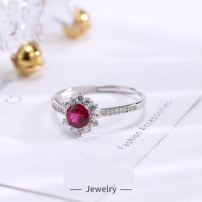 China FASHIONABLE Hot Selling Red Garnet Ring Female 925 Sterling Silver Sun Flower Diamond Ring Wedding Ring for sale