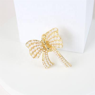 China WeSparking fashion EMO Gold Plated Pearl Claw cut hair accessories hair claw Bowknot shape hair claw for sale