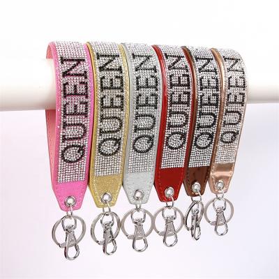 China FASHIONABLE Colorful Pendant Key Chains Jewelry Accessories EMO Delicate Diamond Letter Design Westparking Wrist Strap Key Chain for sale