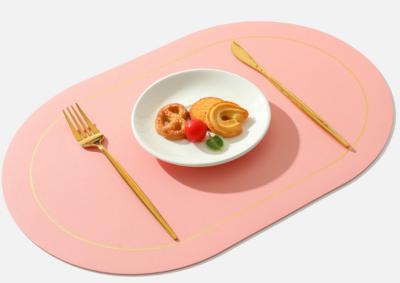 China Convenient and user-friendly oval shaped Western food mat with anti slip particle leather table mat for hotel and home en venta