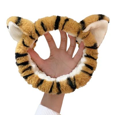 China Newest Next Headbands Coral Fleece Head Band Cartoon Tiger Fluffy Facial Makeup Spa Fashion Wraps Headbands for sale