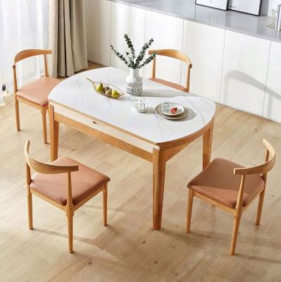 China Luxury and Space Saving Modern Extendable Light Weight Wooden Dining Table with Chairs for sale