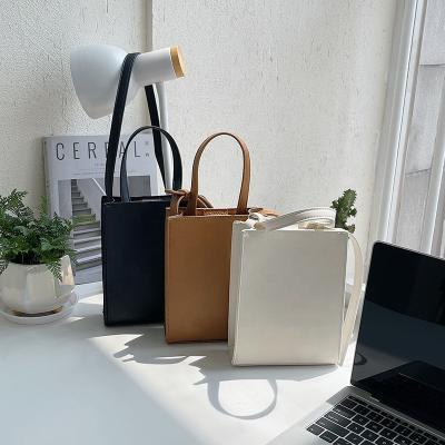 China Japanese customized new hard women handbag logo fashion contracted bag simple elegant temperament cross-body small square shoulder bag for sale