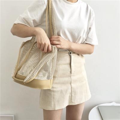 China Korean version of the new fashion women's summer hollow mesh bucket bag fashion leisure shoulder bag beach bag simple temperament handbag for sale