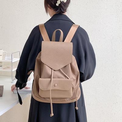 China Popular Casual Oxford Women's Large Capacity Drawstring Shoulder Bag PU Leather Stitching Shoulder Bag Fashion Anti-theft Backpack for sale