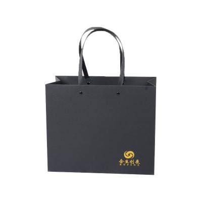 China Recyclable Customized Luxury Paper Clothing Bag Recycled Black Paper Shopping Bag for sale