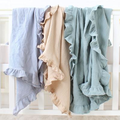 China Eco-Friendly Solid Color Anti-pilling 2 Layer Gauze Ruffle Baby Blanket 100%Cotton Muslin Baby Wraps With Tassels for sale