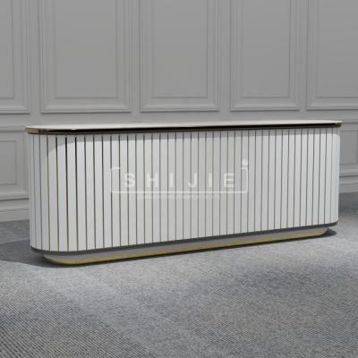 China SHIJIE Custom Expandable Modern Wood Led Hotel Salon White Spa Reception Desk Salon Gym Store Case For Sale for sale