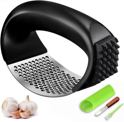 China Sustainable Kitchen Accessories Multi Function Kitchen Gadgets Garlic Chopper with Ergonomic Handle Silicone Garlic Peeler for sale