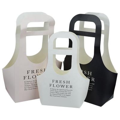 China Custom Recyclable Black Color Logo Print Fashion White Kraft Paper Size Card Packaging Flowers Portable Flower Basket With Handle for sale