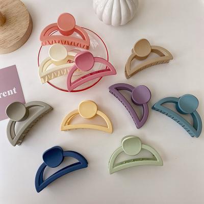 China Fashion High Quality/Factory Source Cute Geometric Hollow Semicircle Shape Solid Color Matte Plastic Hair Claw Big Hair Claw for sale