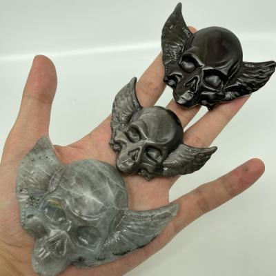 China Wholesale Crystal Carved Skulls Hand Made Crystal Crafts Wings Skulls from Africa for sale