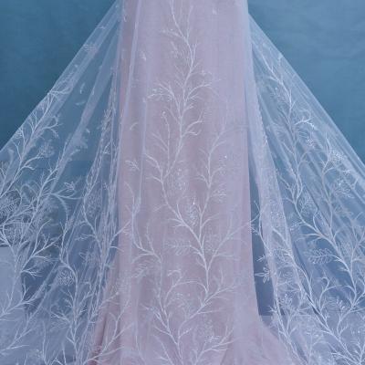 China New Gradient Border Viable Elegant Sequin Embroidery White Wedding Lace Trimming French Mesh Beaded Lace Fabric for sale