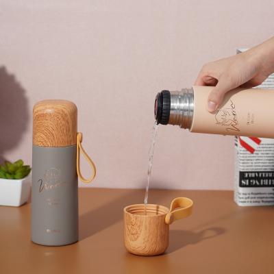 China 304 Stainless Steel PORTABLE Thermos Mug Portable Reusable Vacuum Flask Insulated Cup With Wood Grain Lid for sale