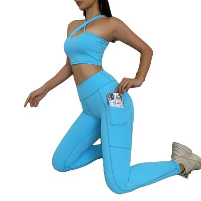 China Breathable Women Compression Workout Sports Fitness Cross Strap Crop Top Yoga Gaiters Set With Pocket Equipments for sale