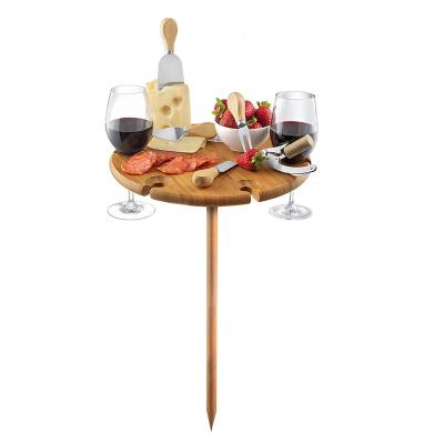 China Sustainable Portable Beach Table For Sand And Grass Natural Bamboo Outdoor Wine Snack And Cheese Tray for sale