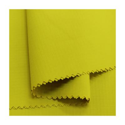 China Waterproof Bio-Comparative Yellow Ribstop Performance Polyester Jacket Fabric Quick Dry for sale