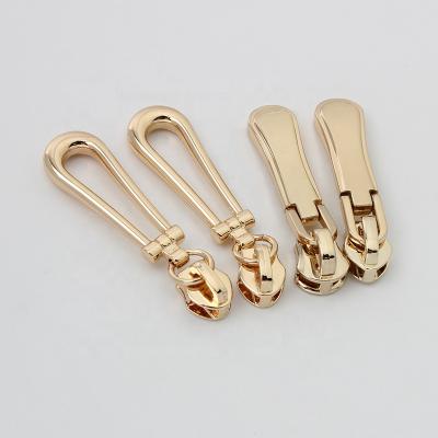 China Nolvo 3Sizes Wholese Useful Alloy Head 3D Pattern Shiny Polished Logos Embossed Silder Clothes Zippers for sale