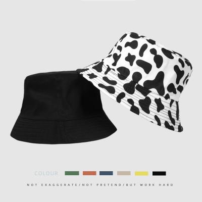 China Sunshade 2021 European and American bucket hat cow printing new cow double-sided hat hat basin leisure neutral for sale