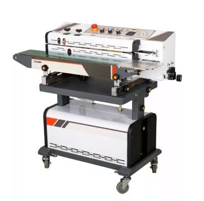 中国 Nitrogen Gas Flushing Vacuum Continuous Band Sealer Plastic Bag Heat Sealing Machine With Ink Roller Printing 販売のため