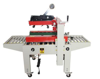 중국 FXJ-6050 Up And Down Drive Belt Carton Sealer With Tape Carton Sealing Machine 판매용