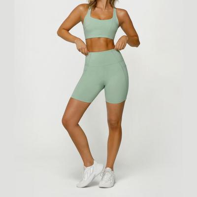 China Breathable Light Green Custom Logo High Waist Hips Tight Sports Shorts Yoga Fitness Climbing Five Pants With Pockets for sale