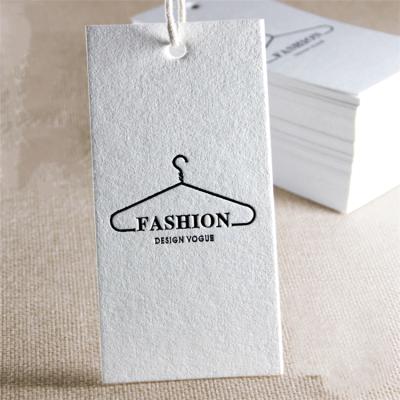 China Sustainable Design Luxury Black Foil Stamping Clothing Hang Tags Debossed Hangtags for sale