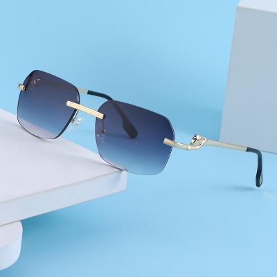 China Famous Brands Metal Rimless Leopard Glass Designer Small Sun Glasses Women Men Fashion Sun Glasses Main Sunglasses for sale