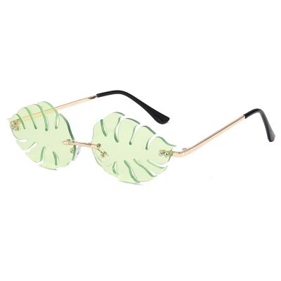 China Retro Cute Euromonk Fashion Sunglasses Women Rimless Shades Sun Lenses Weed Metal Leaf Sunglasses Leaf for sale