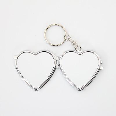 China Custom Heart Shape Pocket Mirror Heart Shape Metal Sublimation Makeup Key Chain Mirror With Your Pictures For Valentine's Day Gifts for sale