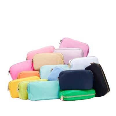 China Low MOQ Fashion Large Capacity Travel Towel Stock Waterproof Nylon Embroidery Patches Logo Small Cosmetic Bags for sale