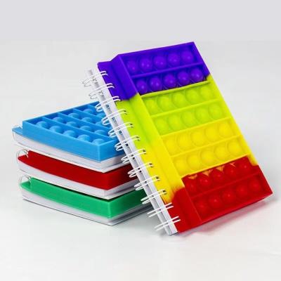 China Cheap Poper Notebooks Silicone Cover Spiral Notebook Rainbow Reliver Effort Push Bubble Pops Toys Stirring Notebooks for sale