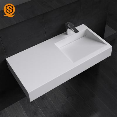 China Pared superficial sólida Hung Lavabo Wash Basin del lavabo del ODM del OEM en venta