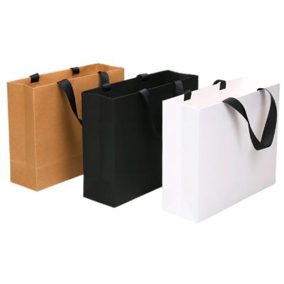 China Custom Materials OEM Luxury Craft Gift Recycled White Kraft Paper Shopping Bag With Handle Manufacturer for sale