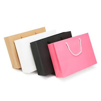 China Recycled Handheld Paper Materials Shopping Bag Yellow Paper Package For Garment for sale