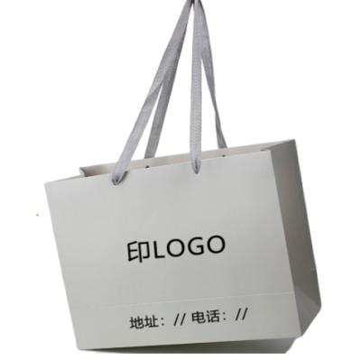 China Recycled Materials Matt Lamination Cosmetic Paper Bag With Hot Stamping Logo for sale