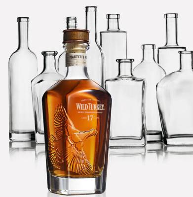 China Transparent glass beverage bottles 700ml with cork for whiskey for sale