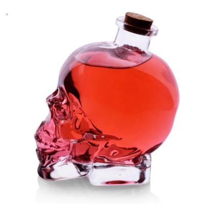 China Clear 500ml 300ml Alcohol Liquor Glass Bottle Skull Shape Alert With Cork for sale