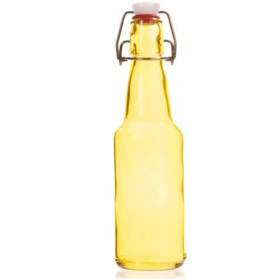 China Beverage Swing Top Sealed Empty Clear Mineral Water Glass Bottle 700ml Premium High Quality for sale