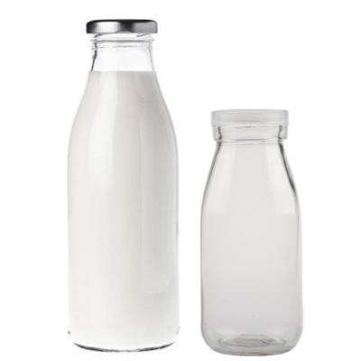 China Daily Life Screen Print Clearly Embossed 500ml Glass Milk Bottles With Cover for sale