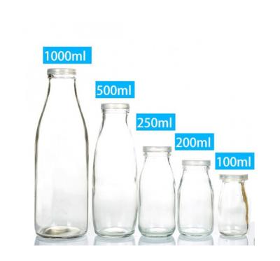 China Clear Glass Milk 100ml 1000ml Milk Bottles With White Tamper-evident Snap Caps for sale