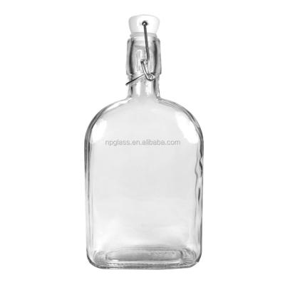 China 500ml sustainable shell glass bottles with swing top for sale