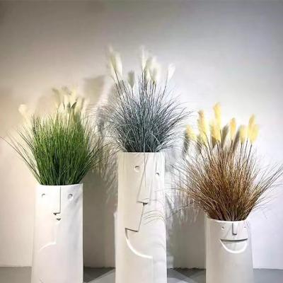 China Durable smiley face shaped fiber flower pots are used for decorative gardening ware fiberglass flower pots for sale