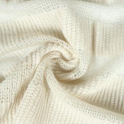 China Discount beige yarn anti static dyed 100 hacci sweater loose knit fabric for garment for sale